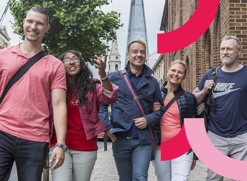 Osteopathy students walking along the street in London, with The Shard building visible behind them