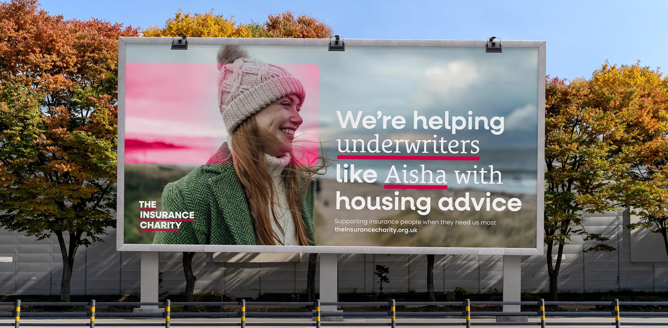 Billboard showing a woman with the underline on her face with the words 'We're helping underwriters like Aisha with housing advice'